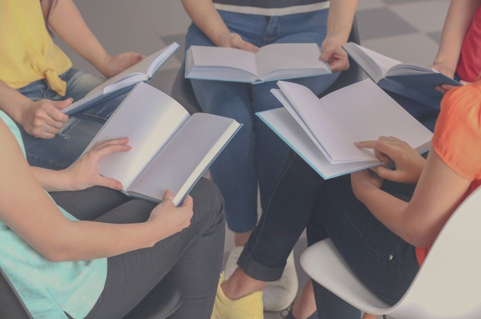 group reading together in a circle