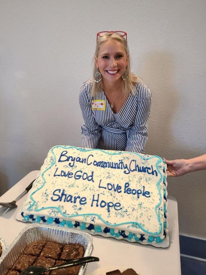 Pastor Jen holding a cake