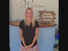 Pastor Jen stands in the lobby and invites new visitors to come check out Bryan Community Church.